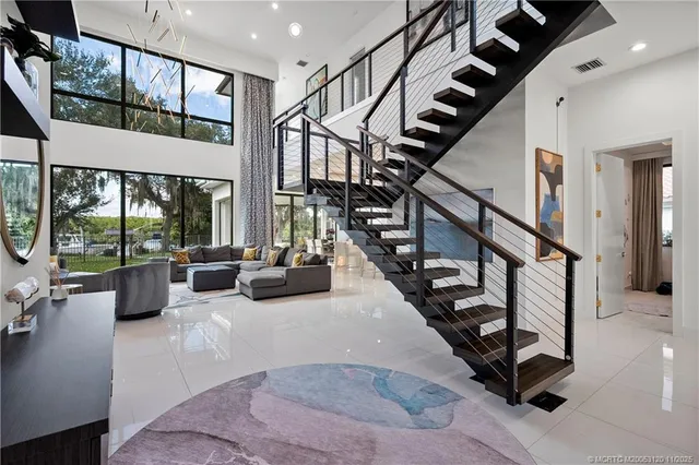 a living room with furniture fireplace and flat screen tv
