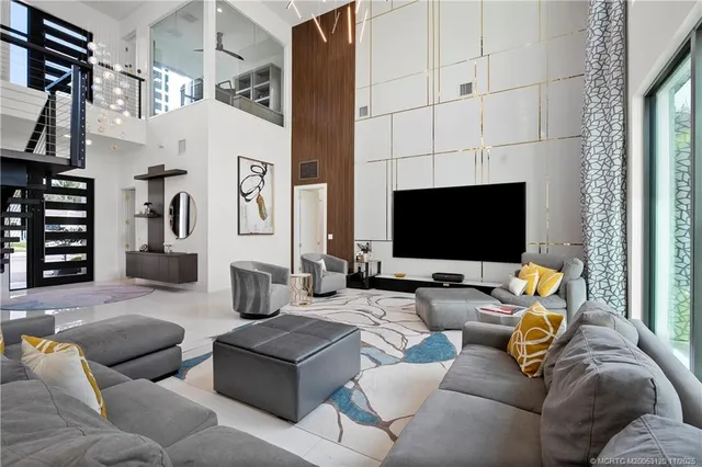 a kitchen with stainless steel appliances granite countertop a stove and a white cabinets