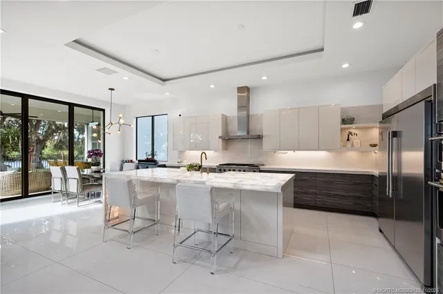 a kitchen with a refrigerator and a sink