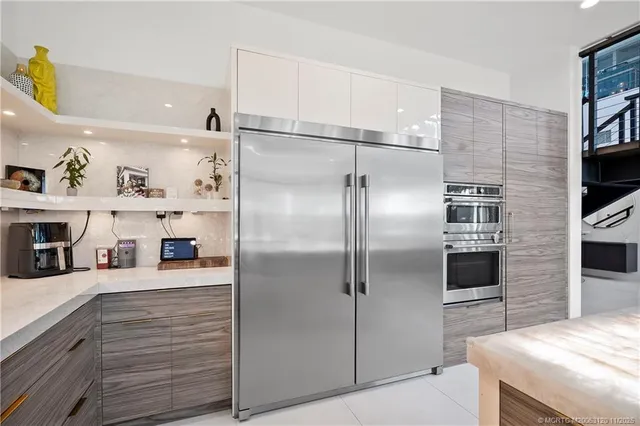 a view of living room kitchen with furniture and flat screen tv