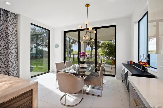 a spacious bedroom with a bed and a large window