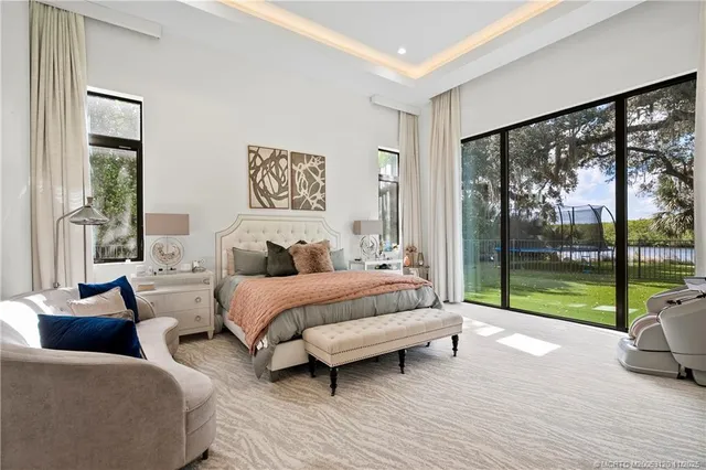 a bedroom with a bed and flat screen tv