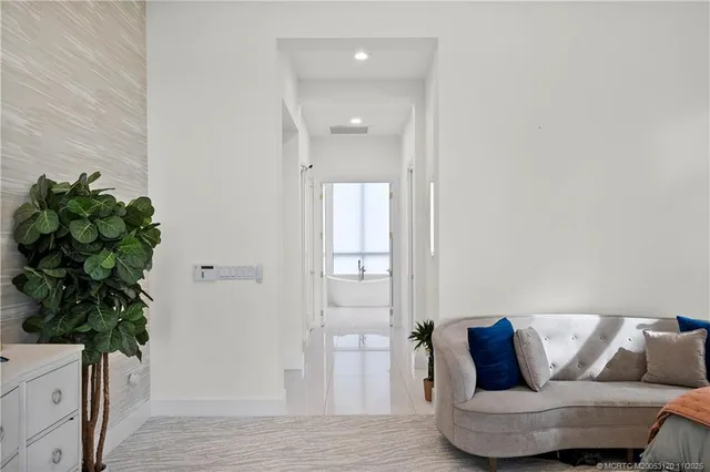 a room with table chairs and cabinets