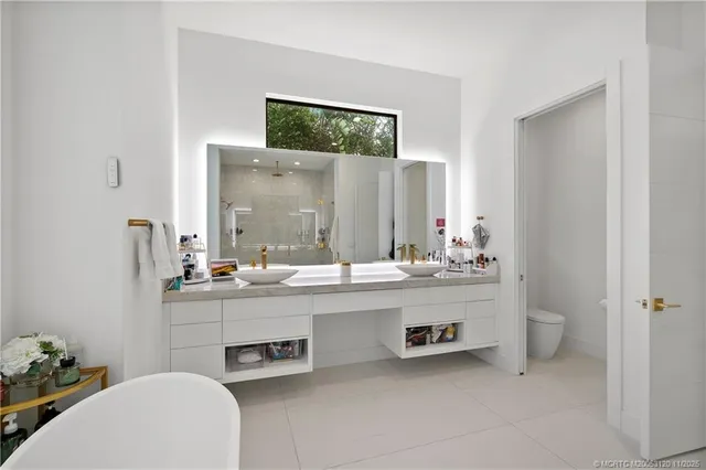a white bath tub sitting in a bathroom