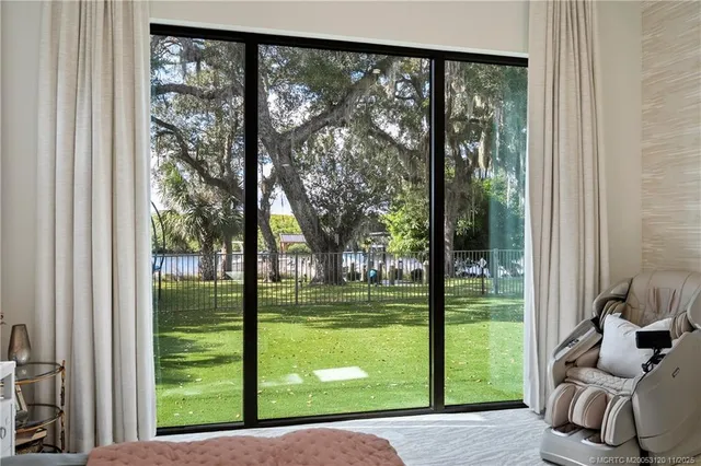 a bathroom with a granite countertop toilet a sink and a mirror