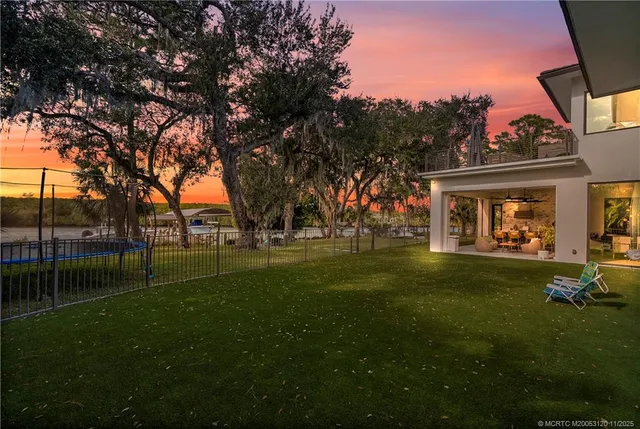 a view of a park with large trees