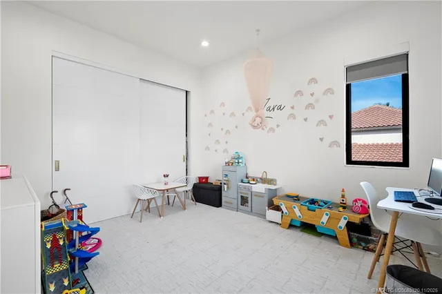 a bedroom with a bed and a couch