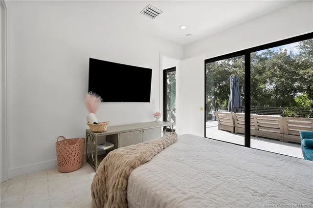 a bathroom with a double vanity sink toilet and shower