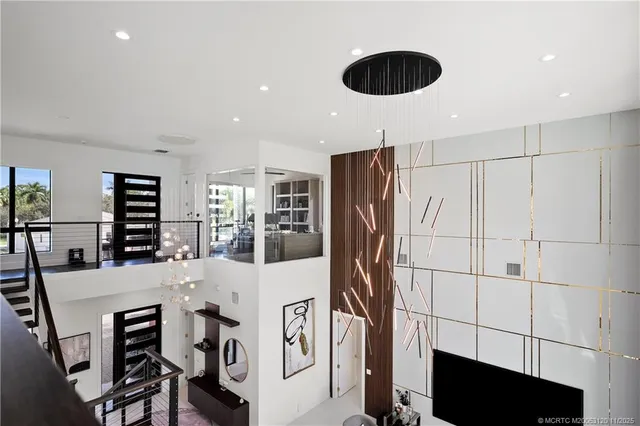 a very nice looking living room with a large window and wooden floor