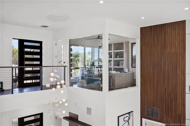 a patio with wooden floor and outdoor seating