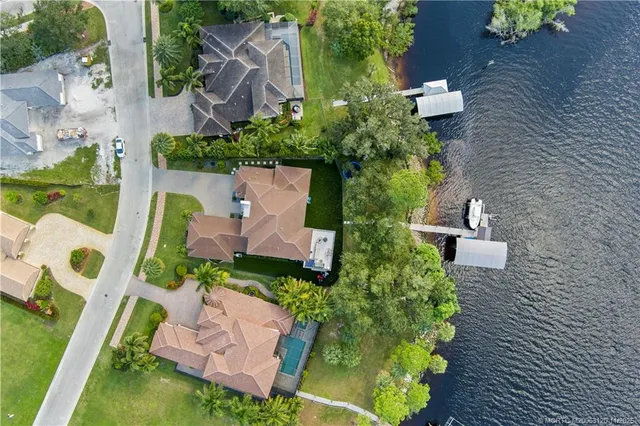 an aerial view of a house with outdoor space