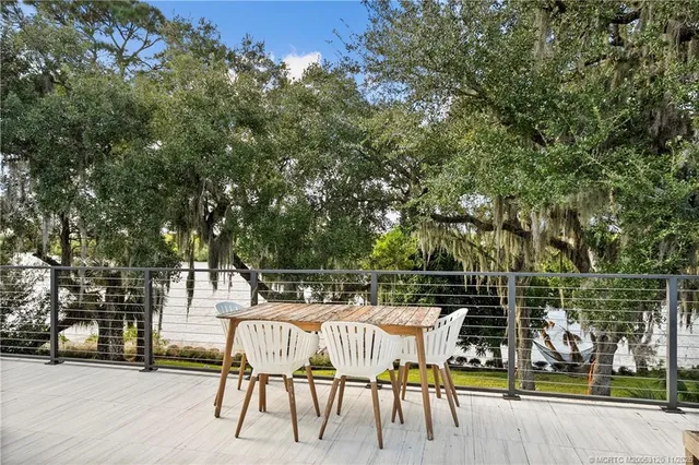 a view of a park with large trees
