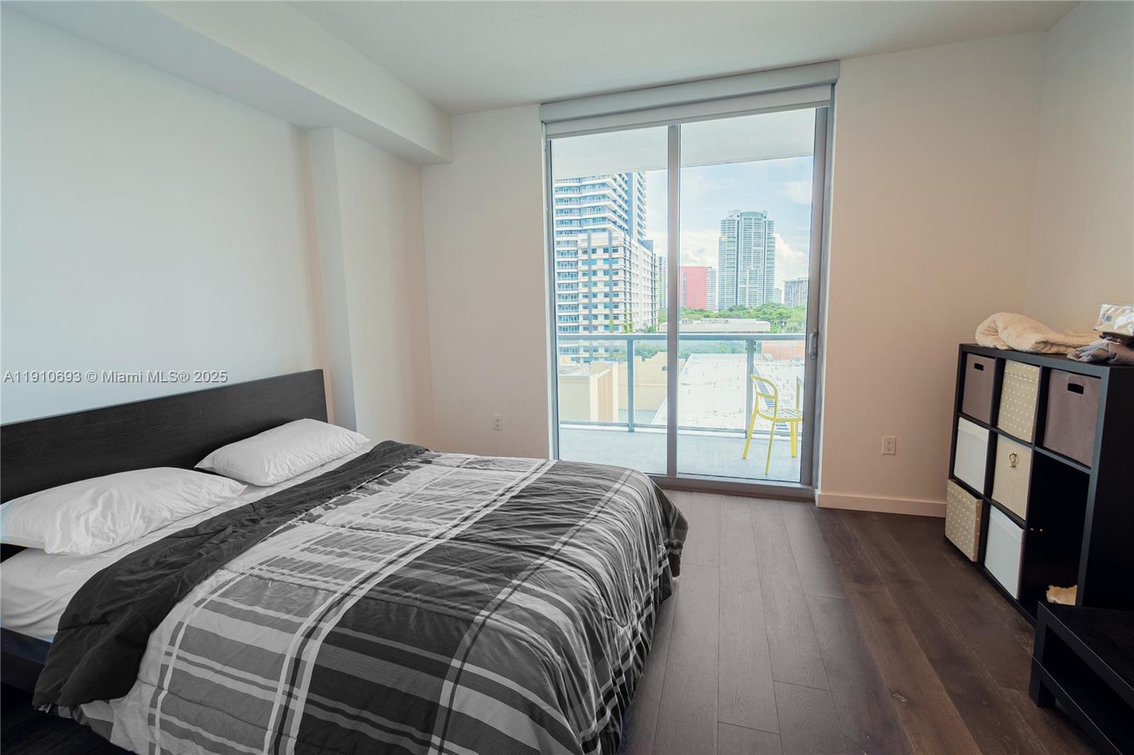 79 Southwest 12th Street, Unit 1002S Miami, FL 33130 - Photo 6 of 22 a bedroom with a bed and a large window