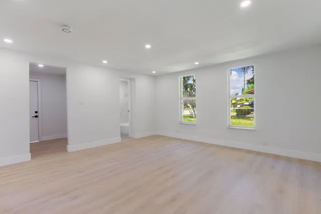 a view of an empty room with a window