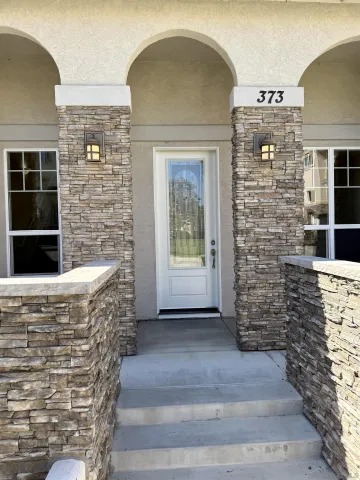 a view of front door of house with outdoor space