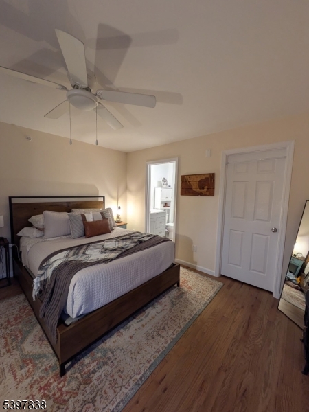 55 Gingerbread Castle Road Hamburg, NJ 07419 - Photo 5 of 7 a bedroom with a bed and wooden floor