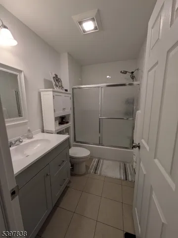 a bathroom with a toilet sink and shower