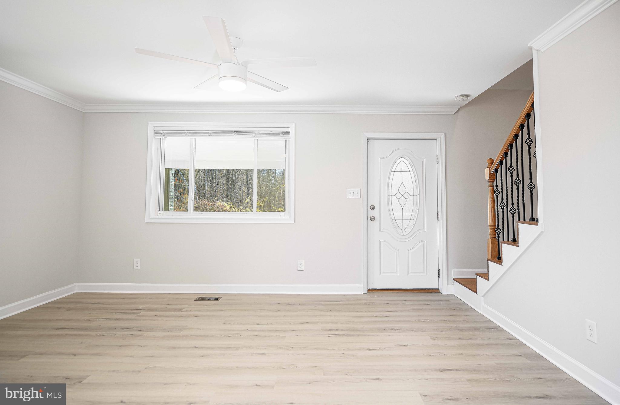 518 Wampler Road Middle River, MD 21220 - Photo 14 of 49 a view of empty room with wooden floor and fan