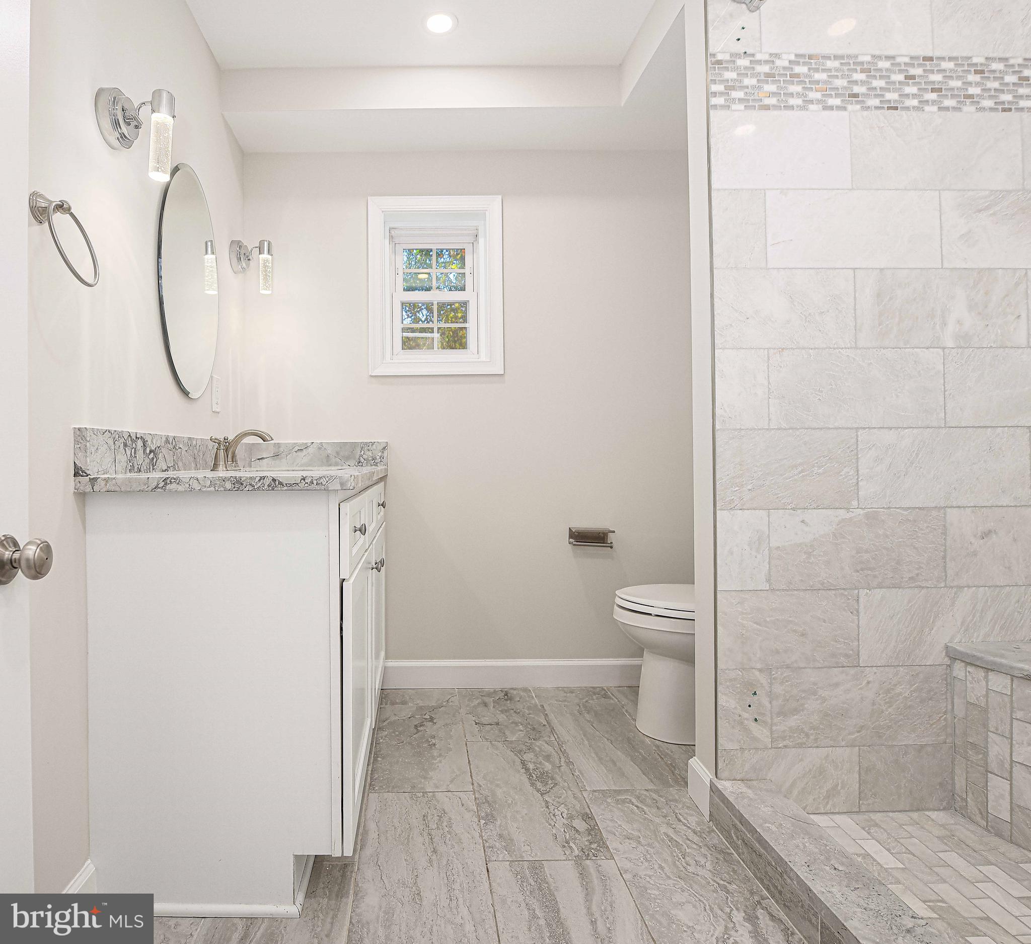 518 Wampler Road Middle River, MD 21220 - Photo 18 of 49 a bathroom with a granite countertop sink a toilet and a mirror