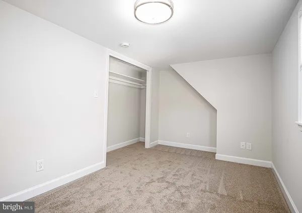 an empty room with a hallway