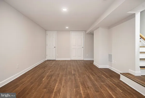 a kitchen with granite countertop a sink and cabinets
