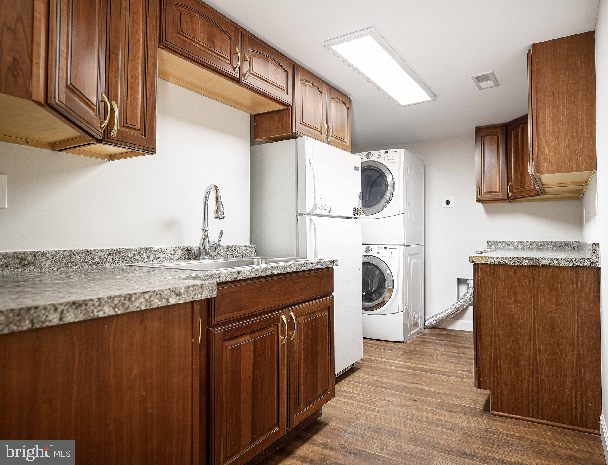 518 Wampler Road Middle River, MD 21220 - Photo 32 of 49 a kitchen with granite countertop a sink and cabinets