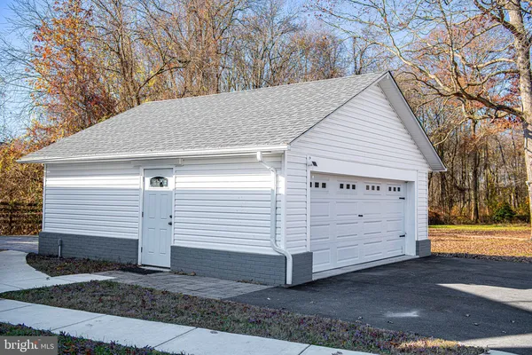 a view of empty room with wooden ceiling