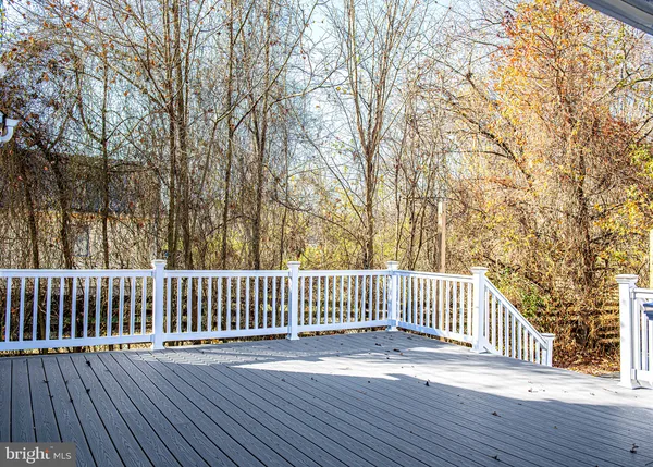 a view of deck with wooden floor and fence