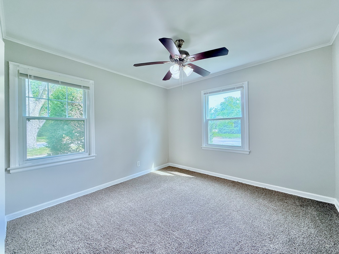 16784 Crane Avenue Hazel Crest, IL 60429 - Photo 12 of 24 an empty room with a window and a fan