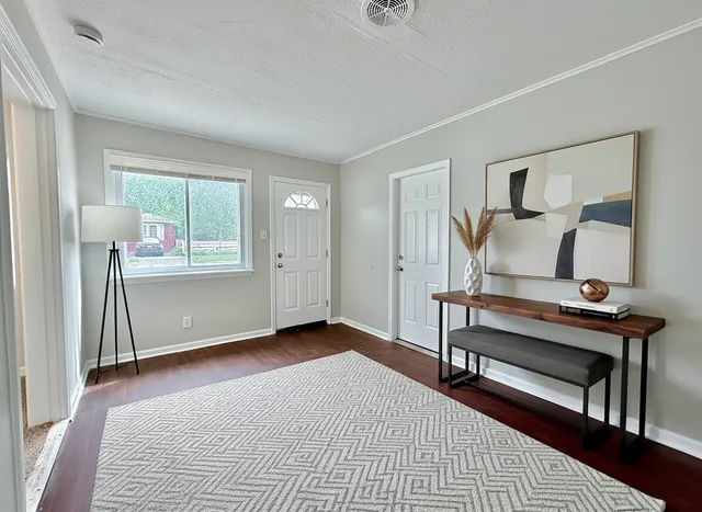 a bedroom with furniture and window