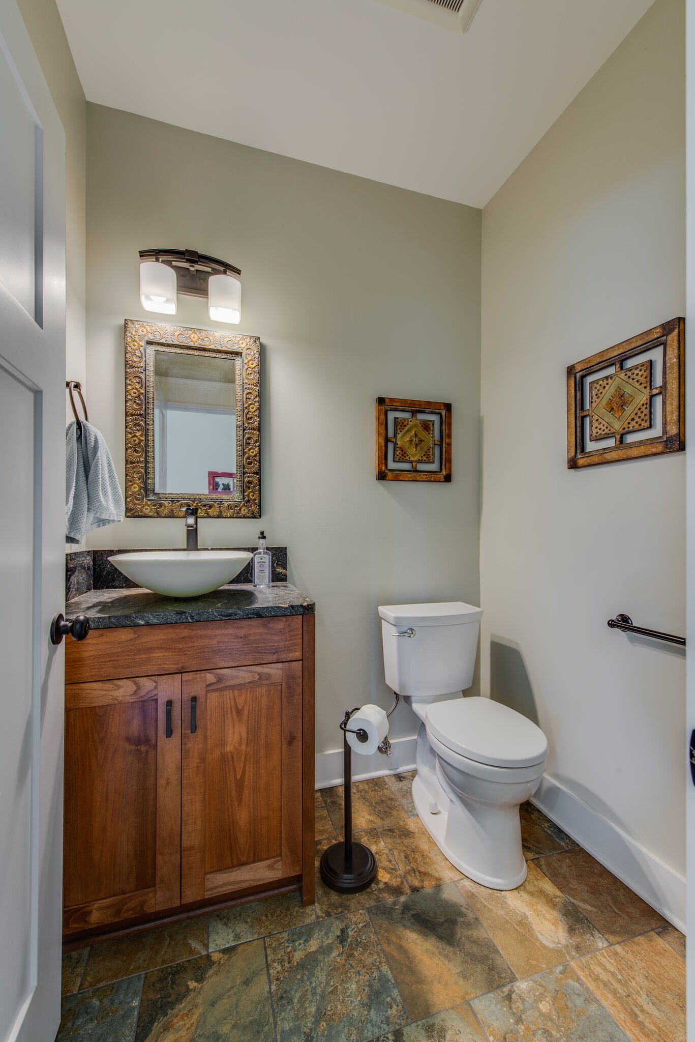 5062 Cathey Ridge Road Manchester, TN 37355 - Photo 28 of 47 a bathroom with a toilet a sink and mirror