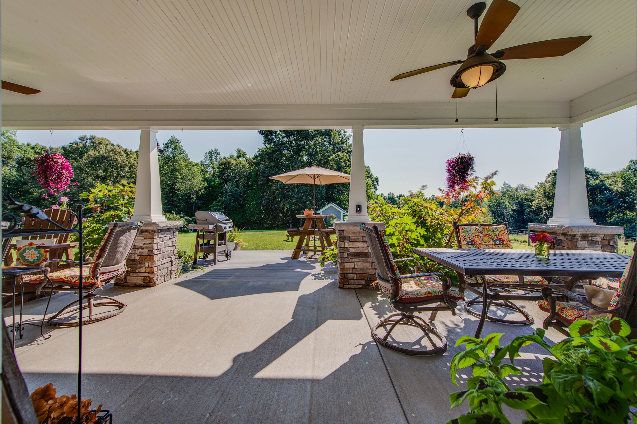 5062 Cathey Ridge Road Manchester, TN 37355 - Photo 33 of 47 a view of a patio with furniture and table umbrella