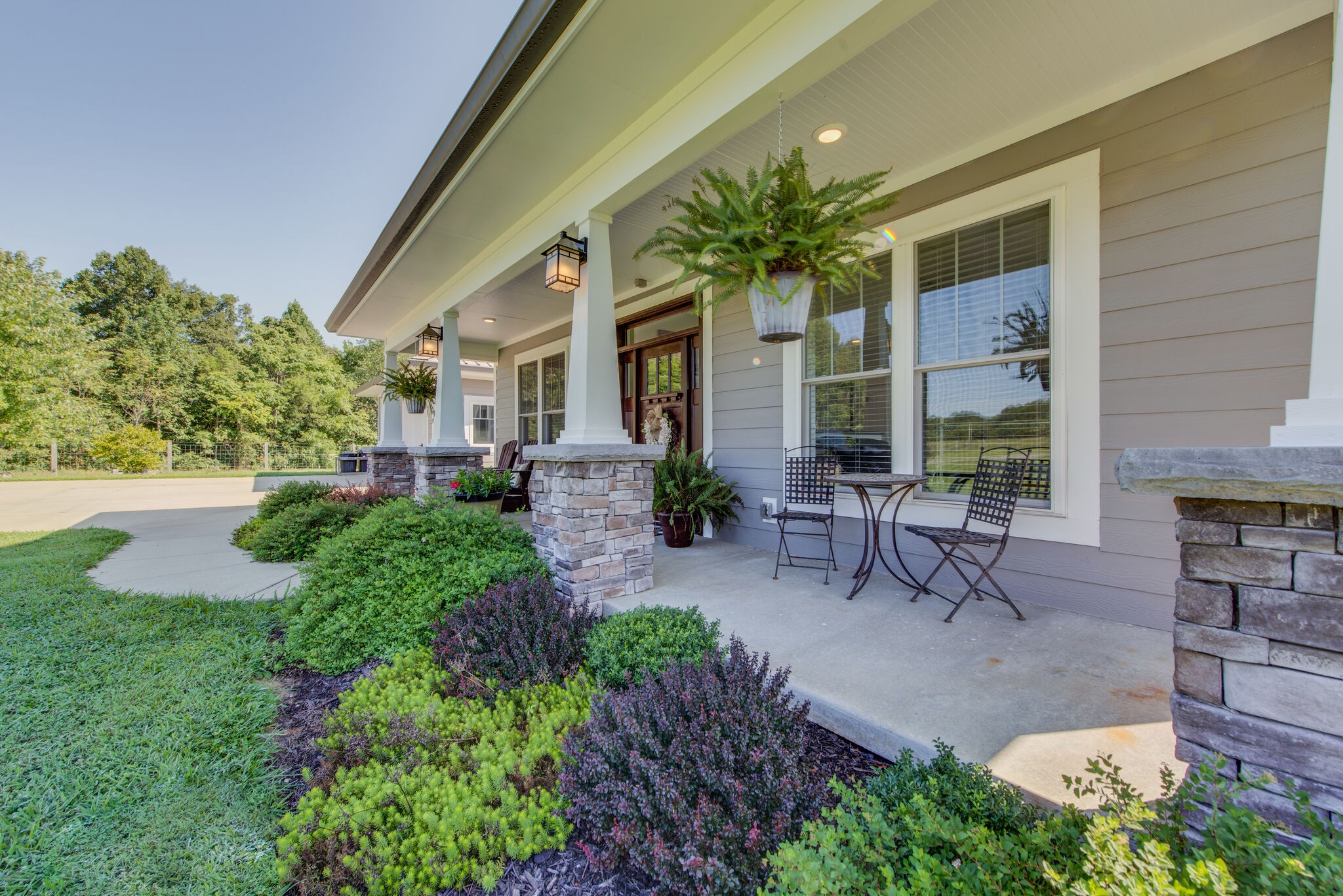 5062 Cathey Ridge Road Manchester, TN 37355 - Photo 5 of 47 a view of a patio with table and chairs and potted plants
