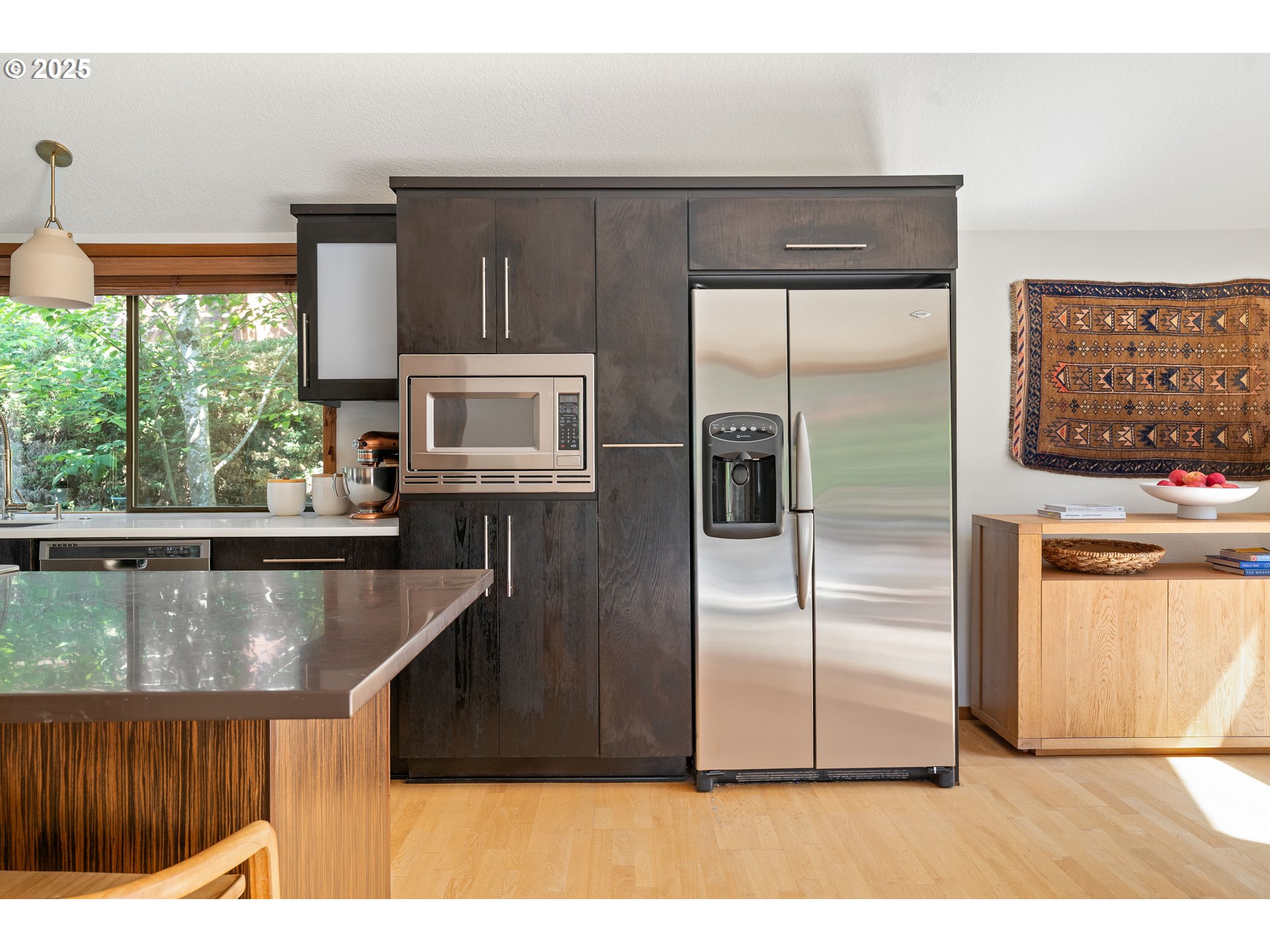 511 Southwest Colony Drive Portland, OR 97219 - Photo 12 of 46 a kitchen with stainless steel appliances granite countertop a refrigerator a stove and a sink with large window