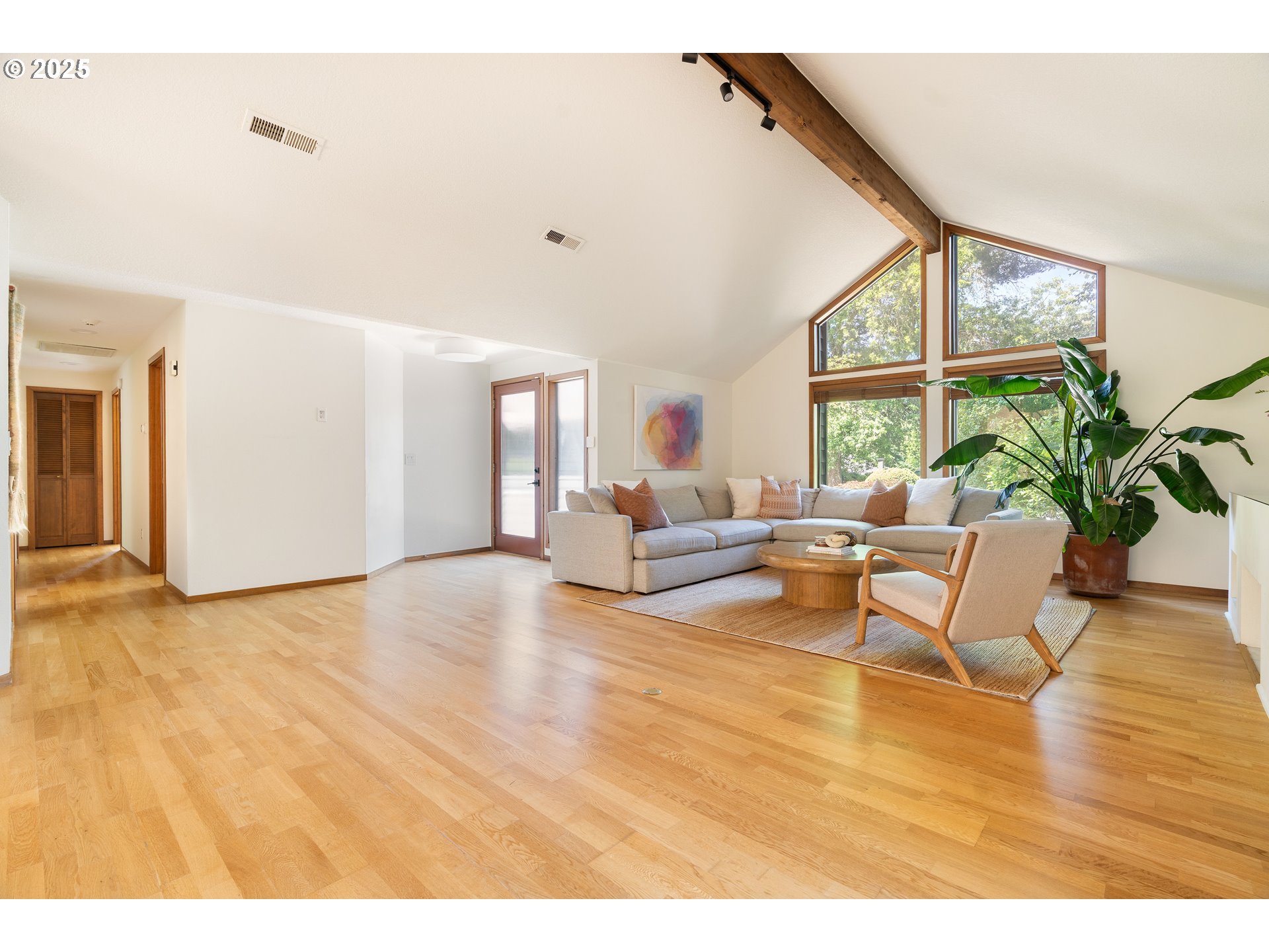 511 Southwest Colony Drive Portland, OR 97219 - Photo 17 of 46 a living room with furniture and a large window