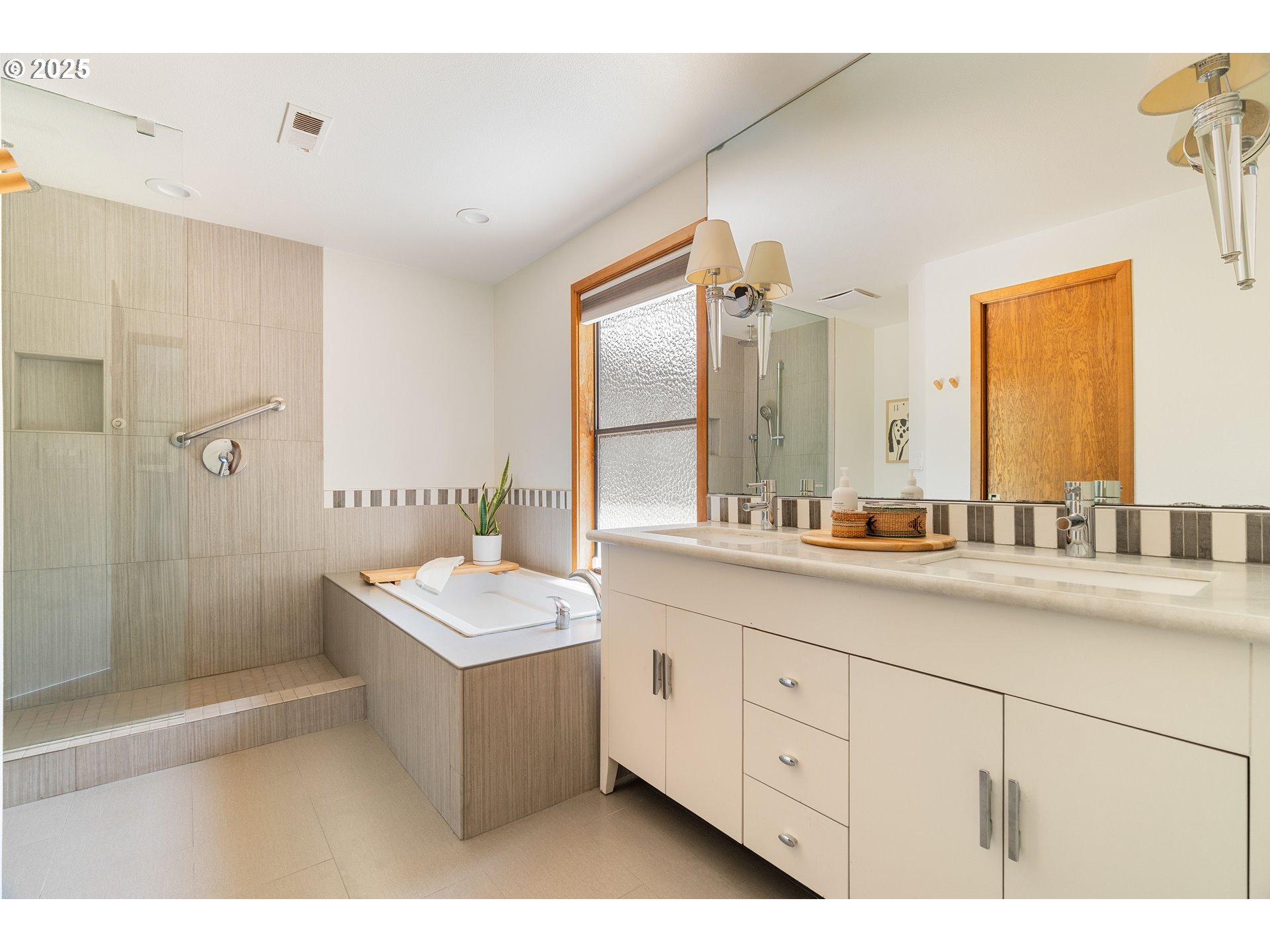 511 Southwest Colony Drive Portland, OR 97219 - Photo 23 of 46 a bathroom with a sink double vanity granite tub shower and a mirror