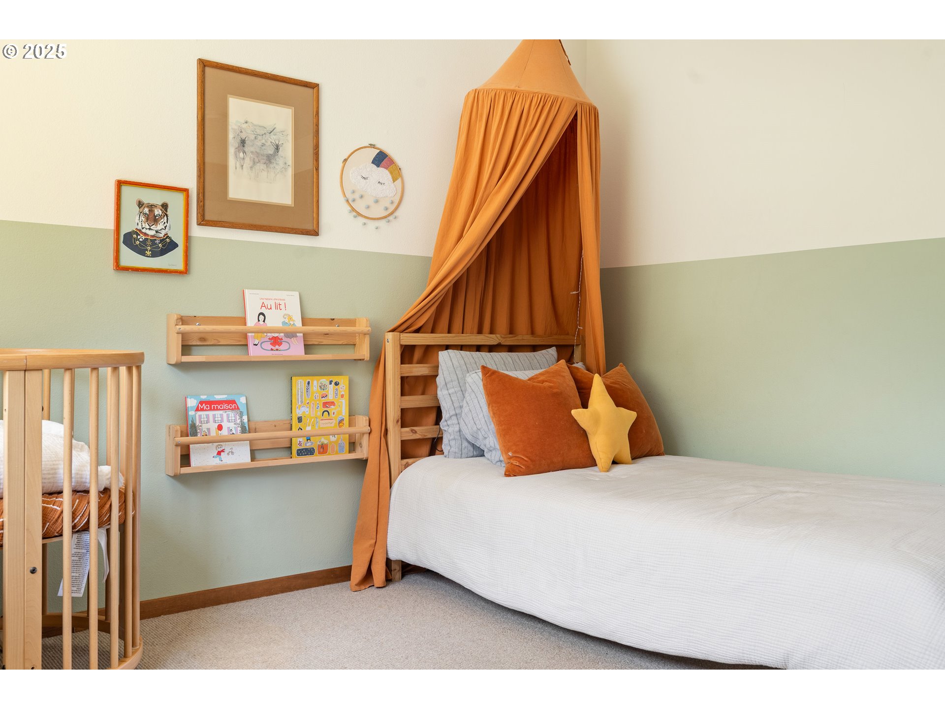 511 Southwest Colony Drive Portland, OR 97219 - Photo 25 of 46 a bedroom with a bed and a bookshelf