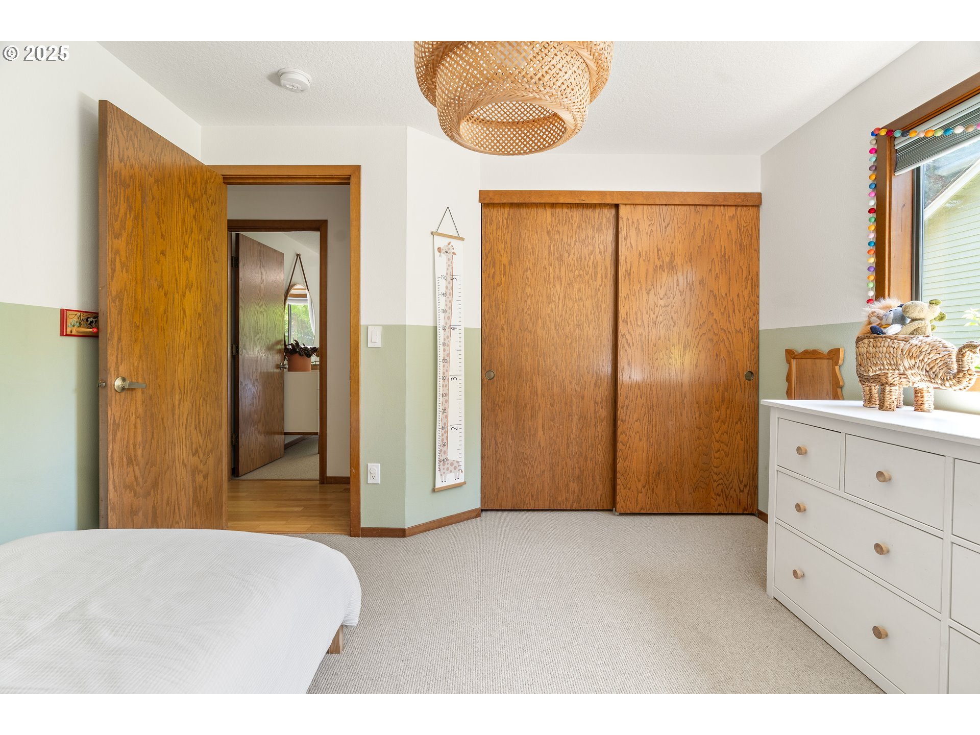 511 Southwest Colony Drive Portland, OR 97219 - Photo 26 of 46 a bedroom with a bed and a dresser