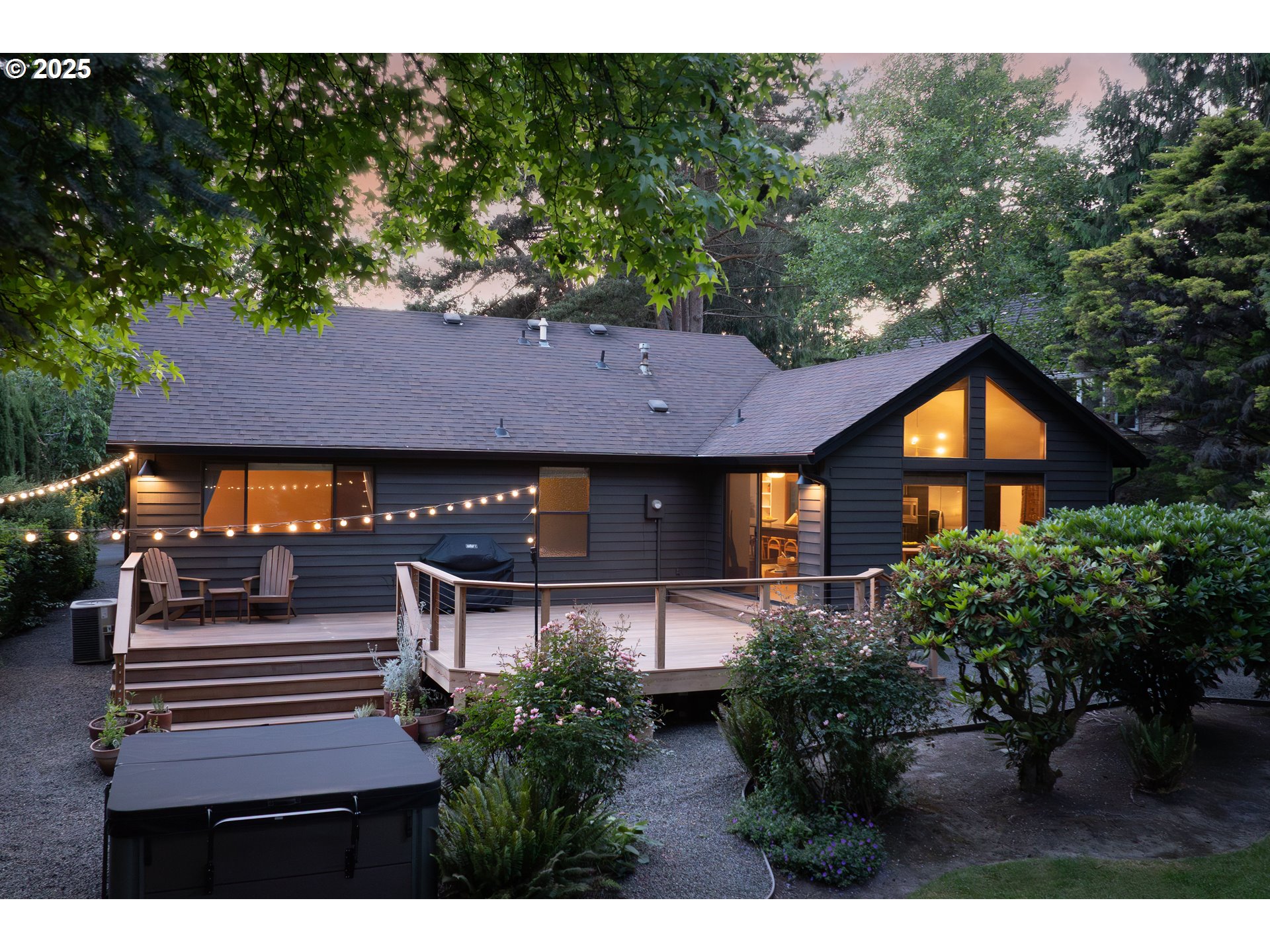 511 Southwest Colony Drive Portland, OR 97219 - Photo 33 of 46 a aerial view of a house with a yard and potted plants