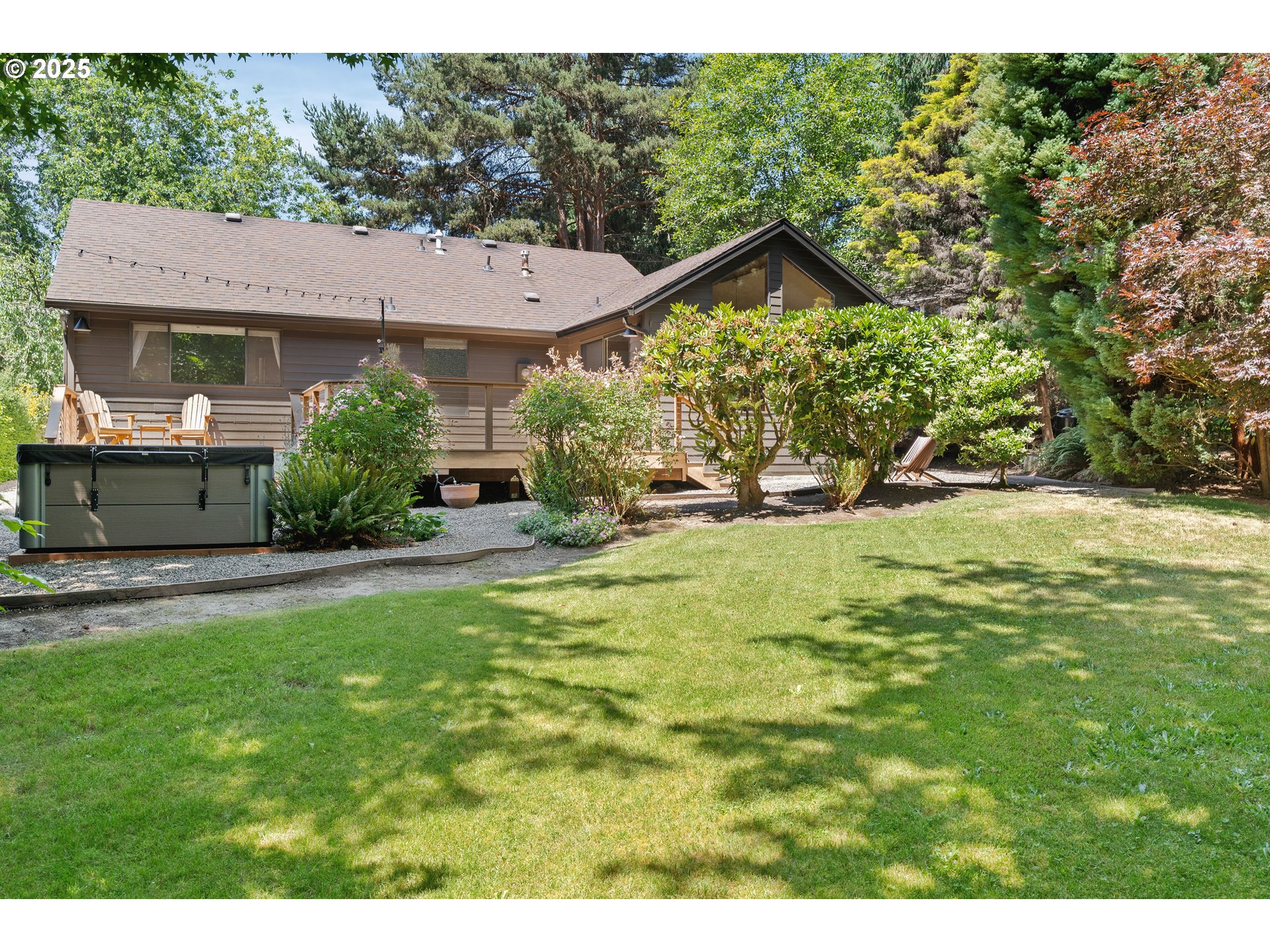 511 Southwest Colony Drive Portland, OR 97219 - Photo 34 of 46 a view of a house with a yard and sitting area