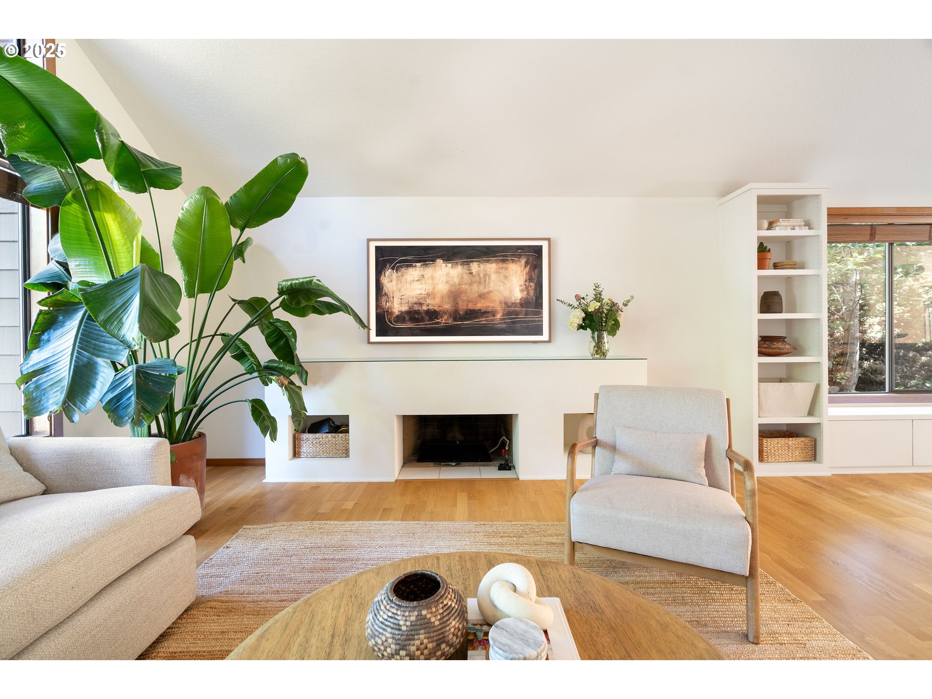 511 Southwest Colony Drive Portland, OR 97219 - Photo 4 of 46 a living room with furniture a fireplace and a potted plant