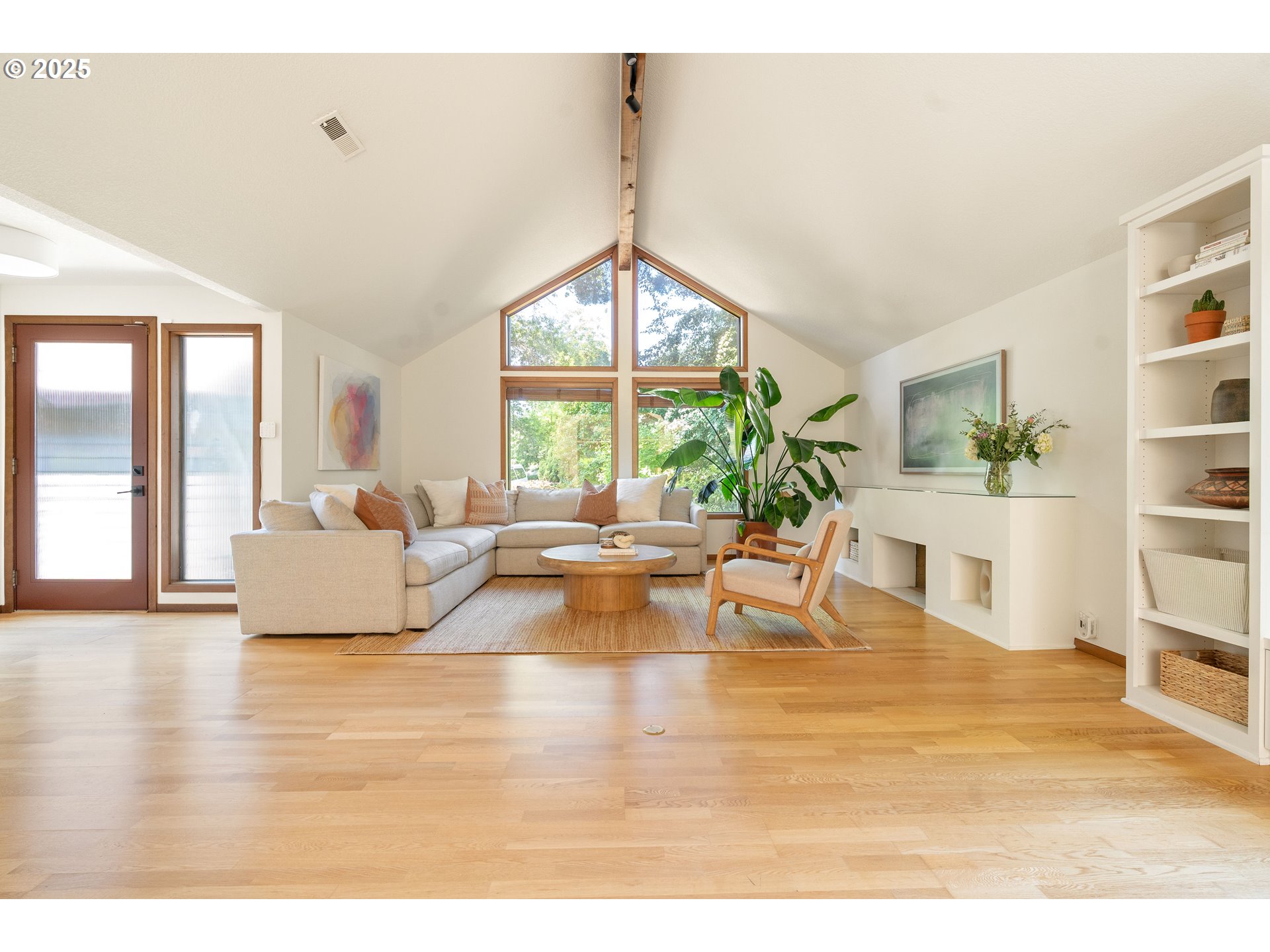 511 Southwest Colony Drive Portland, OR 97219 - Photo 5 of 46 a living room with furniture and a large window