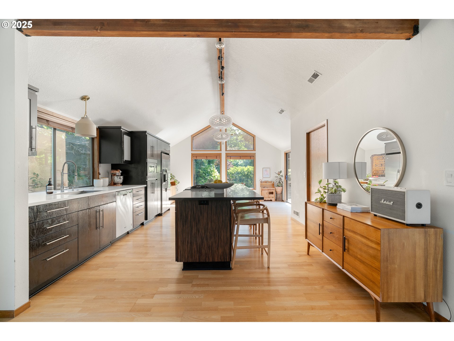 511 Southwest Colony Drive Portland, OR 97219 - Photo 6 of 46 a living room with furniture a large window and kitchen view