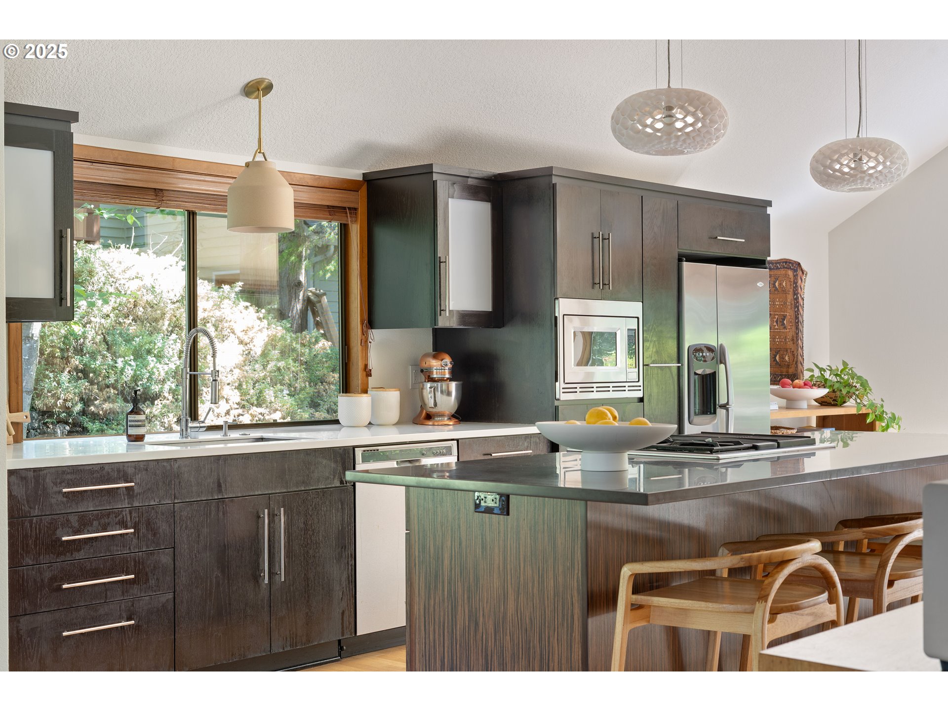 511 Southwest Colony Drive Portland, OR 97219 - Photo 8 of 46 a kitchen with a sink and wooden cabinets