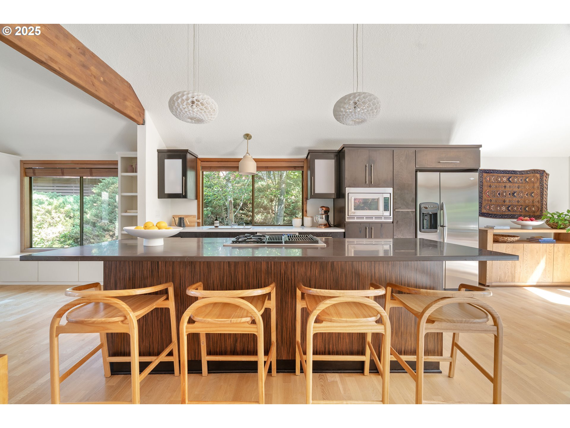 511 Southwest Colony Drive Portland, OR 97219 - Photo 9 of 46 a dining room with wooden floor and large window
