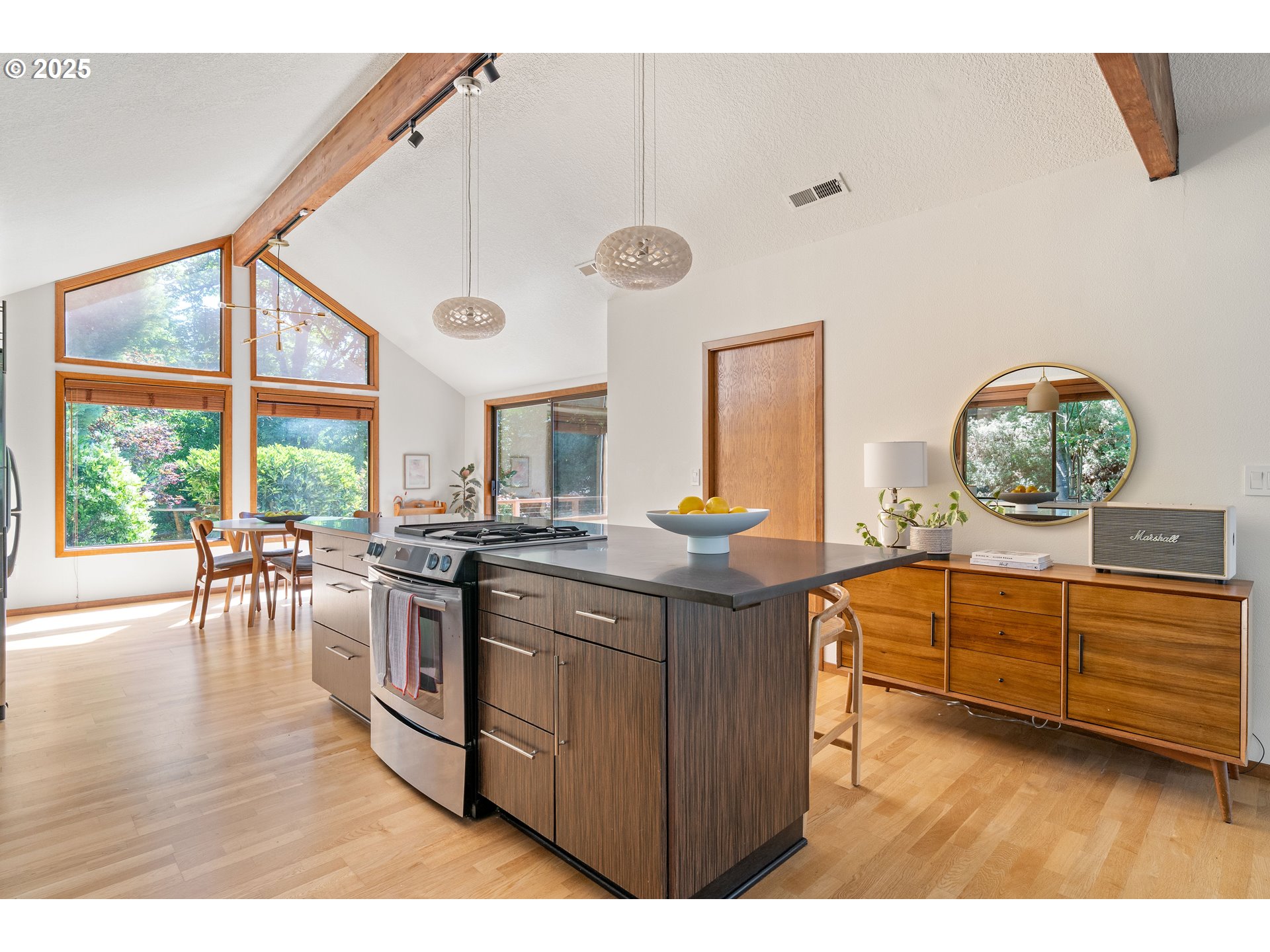 511 Southwest Colony Drive Portland, OR 97219 - Photo 10 of 46 a kitchen with stainless steel appliances granite countertop a stove and cabinets