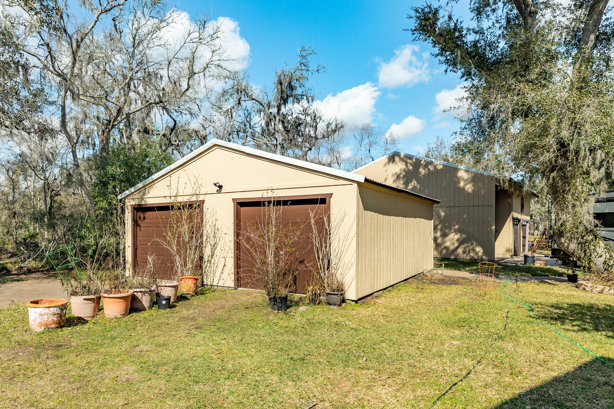 703 County Road 605 Angleton, TX 77515 - Photo 16 of 35 a view of a house with yard and sitting area