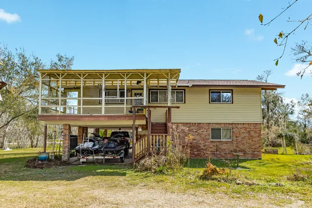 a garden with trees in the background