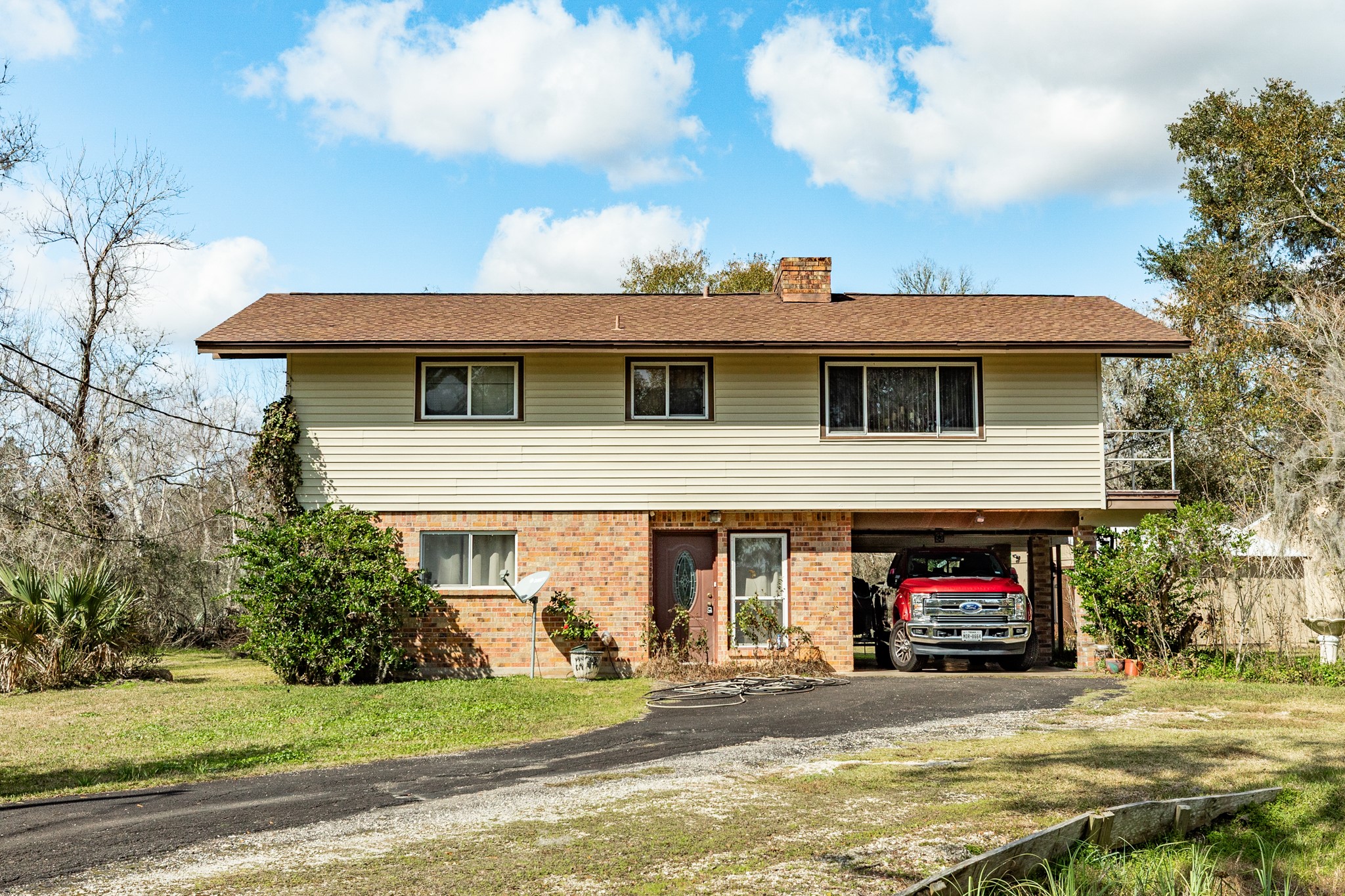 703 County Road 605 Angleton, TX 77515 - Photo 3 of 35 a view of a house with a patio