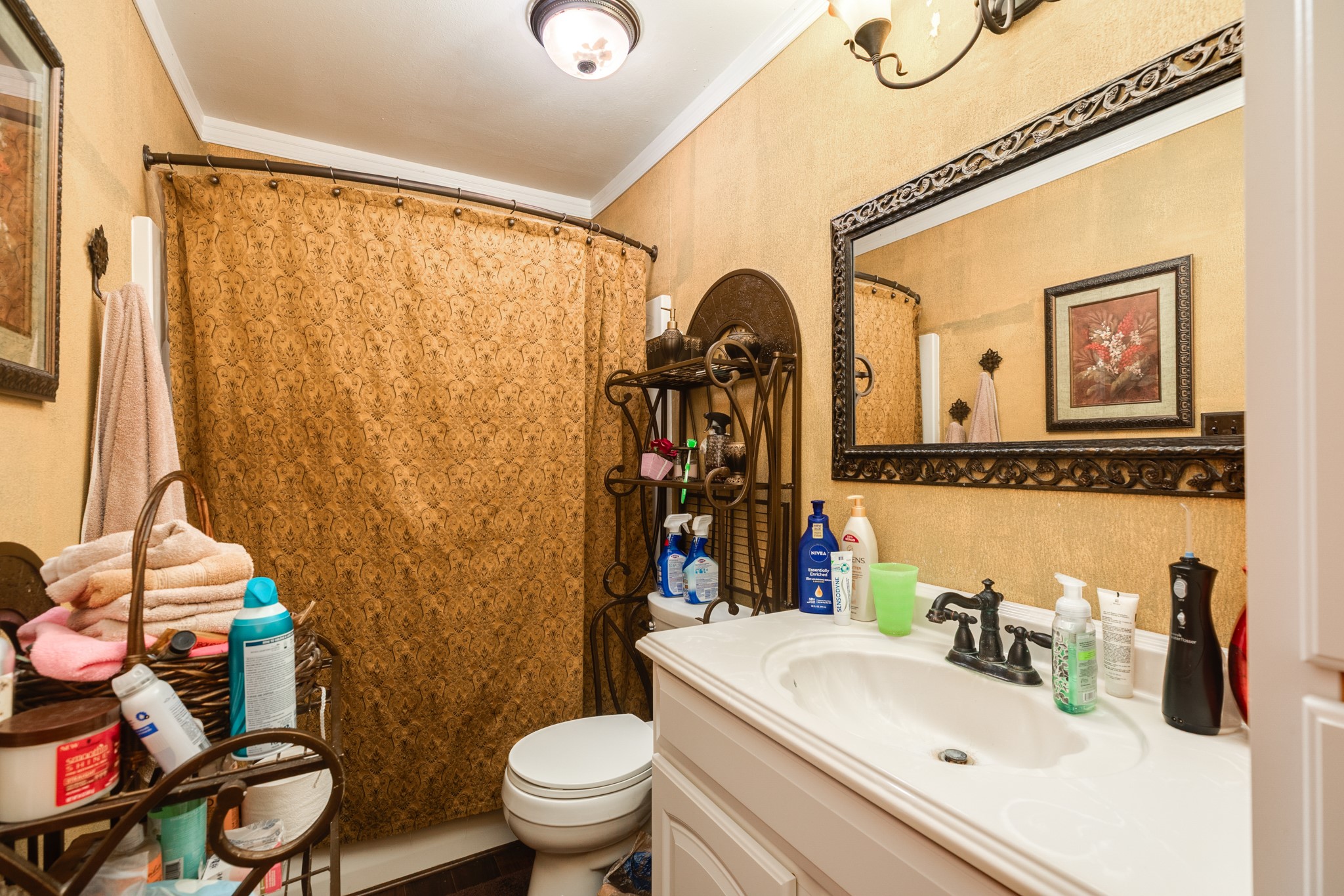 703 County Road 605 Angleton, TX 77515 - Photo 32 of 35 a bathroom with a sink mirror vanity and toilet